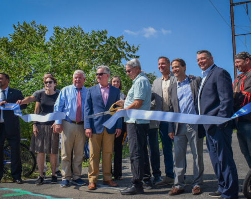 philadelphia officials lined up and cutting the ribbon to open the K&T Trail extension