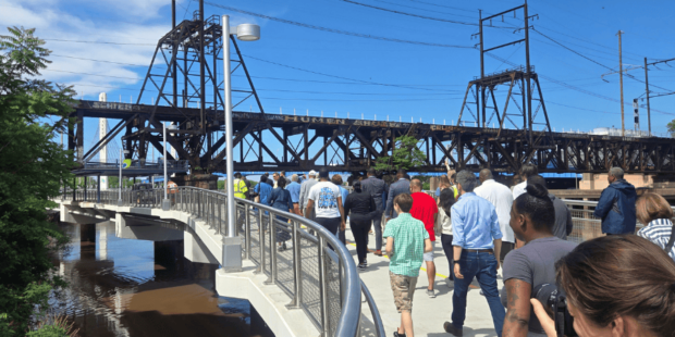 People walking up the ramp to the new Christian to Crescent connector bridge on the Schuylkill River Trail