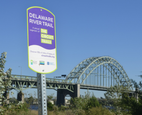 Purple wayfinding sign on the Delaware River Trail