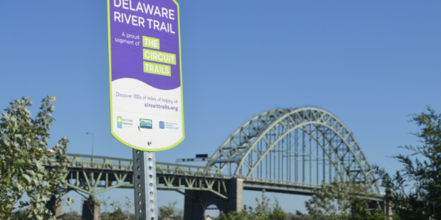 Purple wayfinding sign on the Delaware River Trail