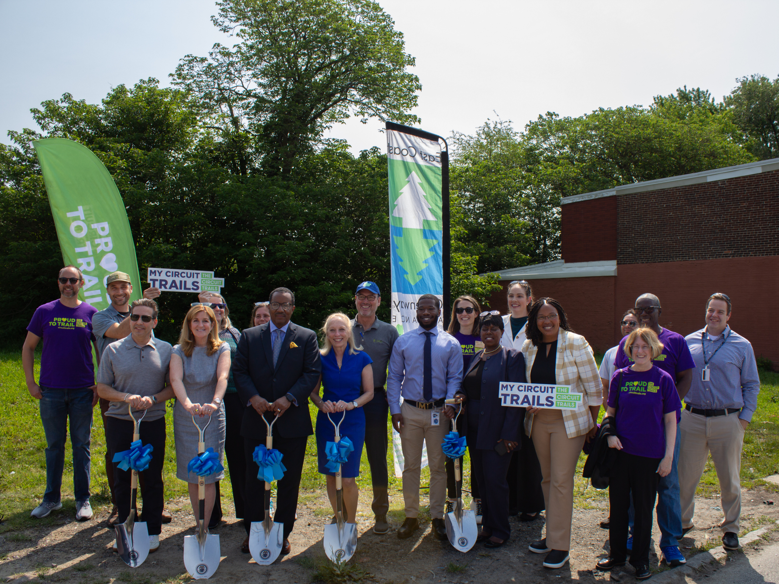 group with shovels celebrating groundbreaking