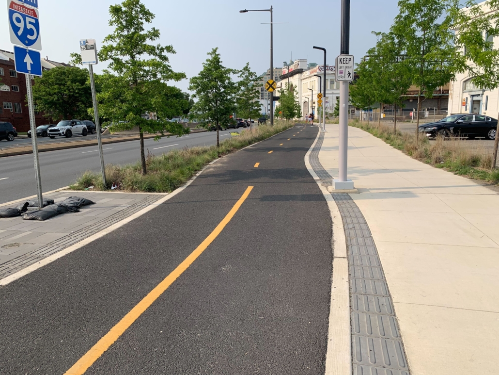 paved section of the Delaware River Trail in Philadelphia will a painted yellow line down the middle of the two-way path to keep users on the right side of the trail