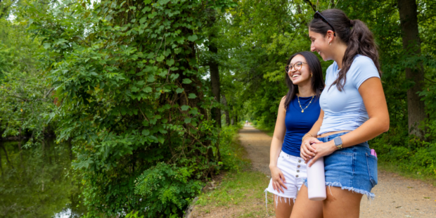Two young girls standing alongside the D&R trail in Trenton, New Jersey
