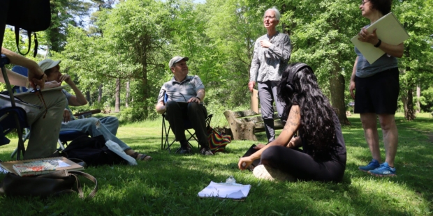 People sitting in grass.