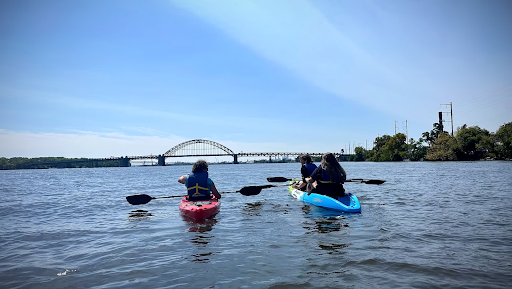 two people in kayaks in a river